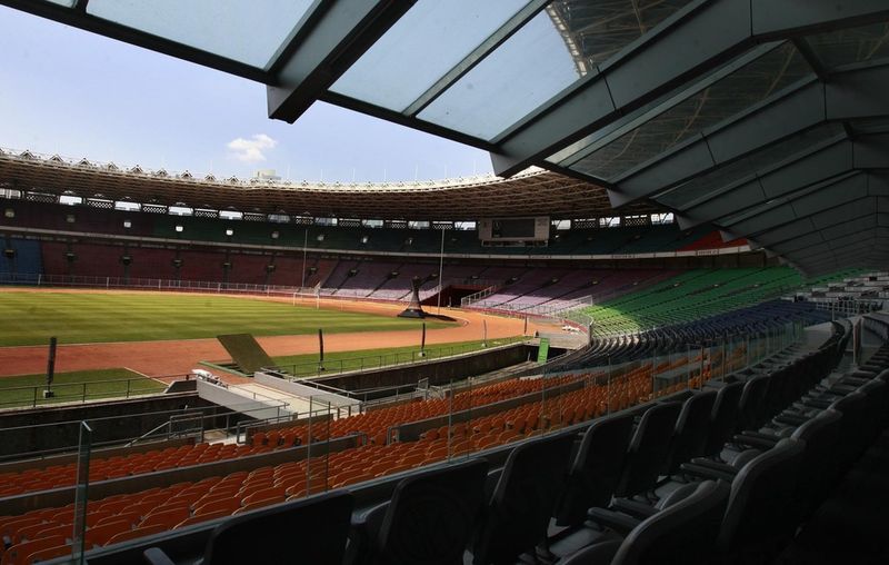 JAKARTA - The pitch is surrounded by a running track